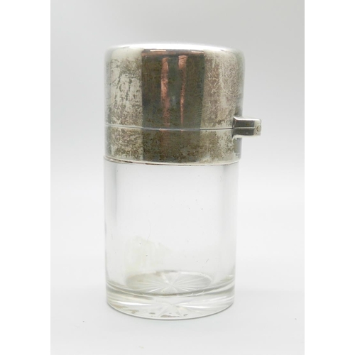 7323 - A silver topped glass salts jar, London 1920, small chip on glass inner stopper