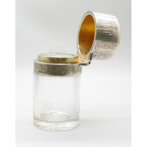 7323 - A silver topped glass salts jar, London 1920, small chip on glass inner stopper