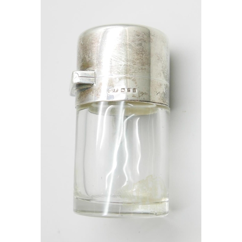 7323 - A silver topped glass salts jar, London 1920, small chip on glass inner stopper