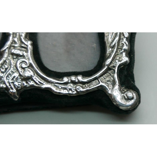 7326 - A silver double photograph frame, Birmingham 1995, 10cm wide