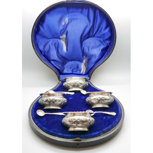 7331 - A cased set of four late Victorian silver salts with spoons by Walker & Hall, 193g