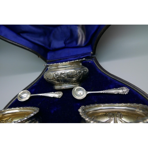 7331 - A cased set of four late Victorian silver salts with spoons by Walker & Hall, 193g