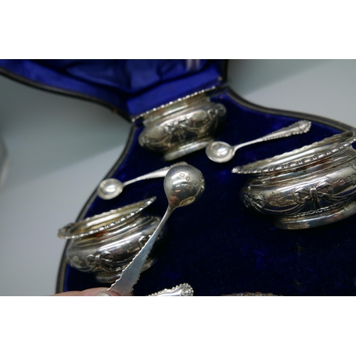 7331 - A cased set of four late Victorian silver salts with spoons by Walker & Hall, 193g