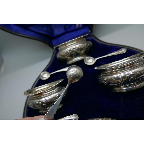 7331 - A cased set of four late Victorian silver salts with spoons by Walker & Hall, 193g