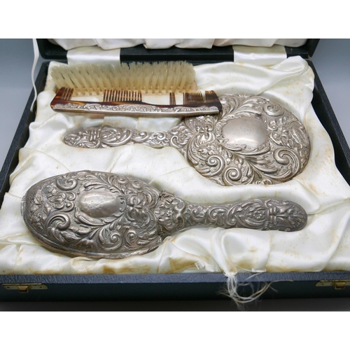 7341 - A silver backed vanity set including hand mirror, a/f