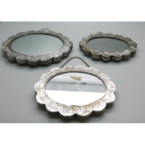 7351 - Five white metal embossed wall hanging mirrors, boxed