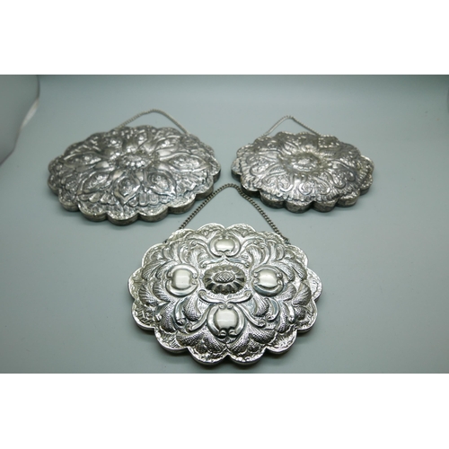 7351 - Five white metal embossed wall hanging mirrors, boxed