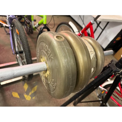 5198 - A weight lifting bench and a quantity of York plastic coated barbell weights including four 4.5kg we... 