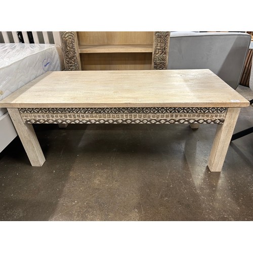 3107 - A wooden coffee table with a sandblast antique white lime finish