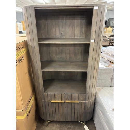 3119 - A mango wood and marble bookcase * This lot is subject to Vat