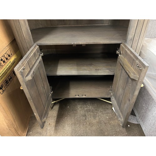 3119 - A mango wood and marble bookcase * This lot is subject to Vat