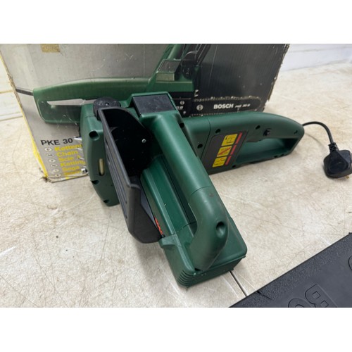 5303 - A Bosch PKE 30 B 240v electric chainsaw and a box of cobblers tools including shoe stretchers and an... 