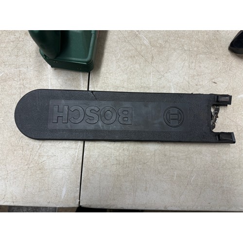 5303 - A Bosch PKE 30 B 240v electric chainsaw and a box of cobblers tools including shoe stretchers and an... 