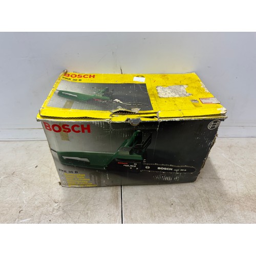 5303 - A Bosch PKE 30 B 240v electric chainsaw and a box of cobblers tools including shoe stretchers and an... 