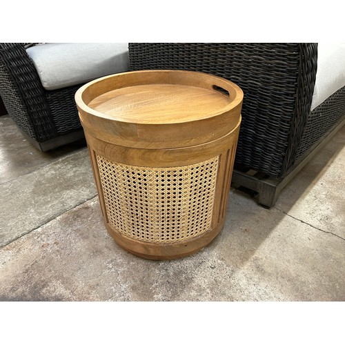 3097 - A round rattan and mango wood side table with storage *This lot is subject to VAT