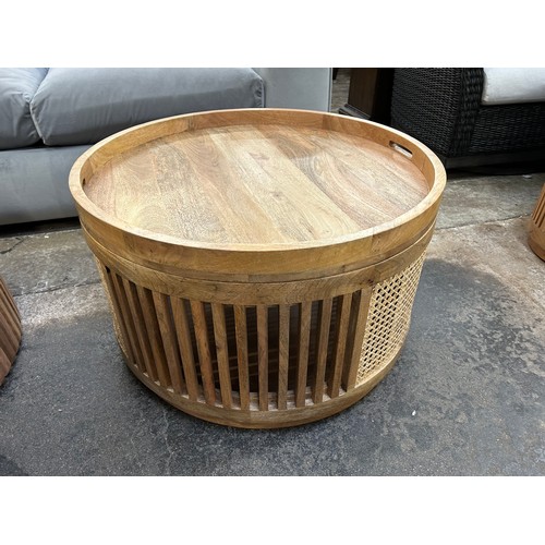 3098 - A round rattan and mango coffee table with storage * This lot is subject to Vat