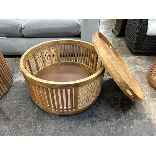 3098 - A round rattan and mango coffee table with storage * This lot is subject to Vat