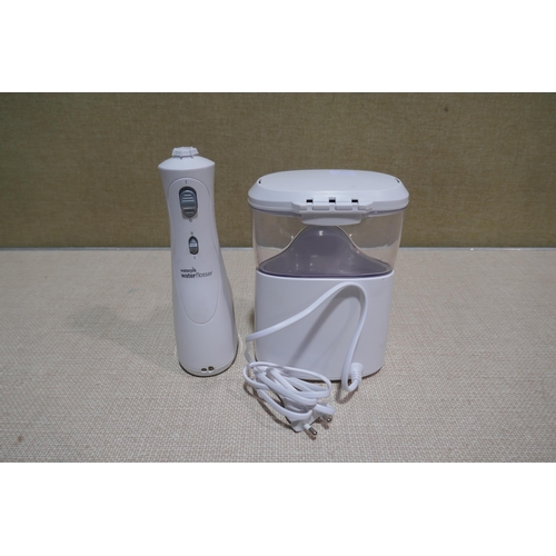 6218 - Waterpik Water Flosser with box and accessories  (340-156) *This lot is subject to Vat