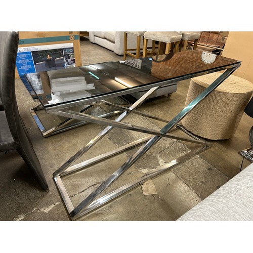 3182 - A black glass and chrome console table