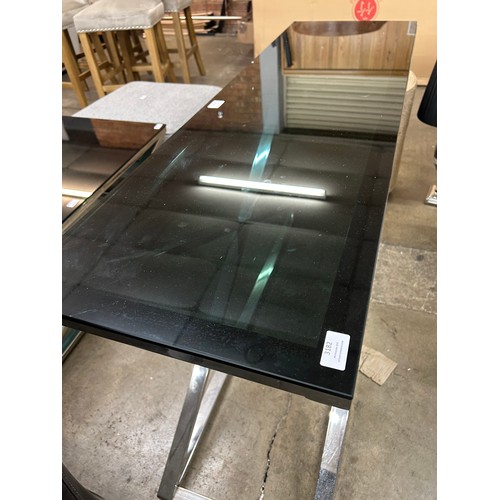 3182 - A black glass and chrome console table