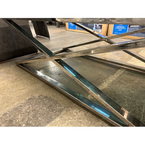 3191 - A black glass and chrome coffee table