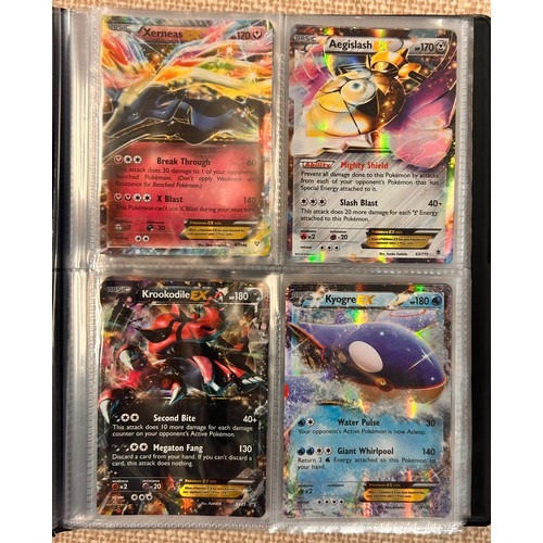 2023 - A folder of vintage Pokémon holographic cards including Ex Mega cards, etc., and holographic 2000 Te... 