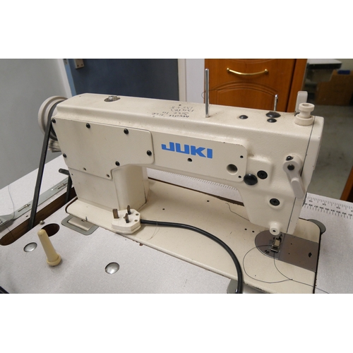 8012 - A Juki industrial sewing machine and table.  Items in lot offered for sale in situ at Bulwell, Notti... 