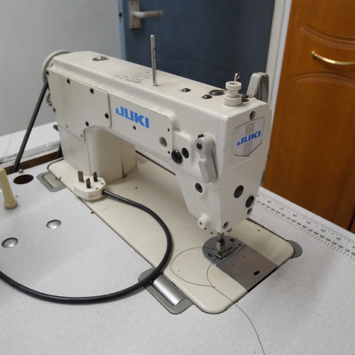 8012 - A Juki industrial sewing machine and table.  Items in lot offered for sale in situ at Bulwell, Notti... 