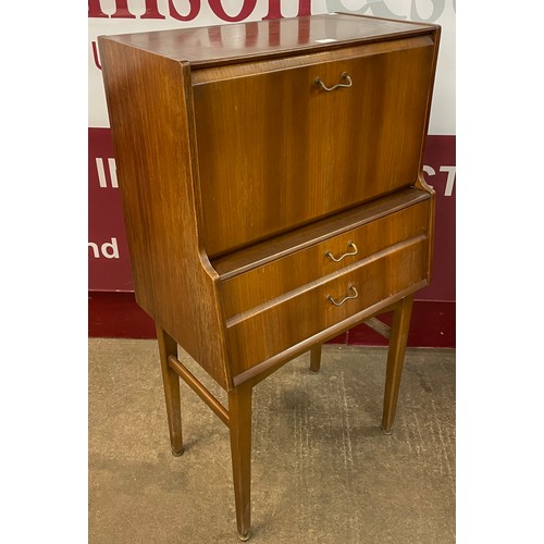 42 - A Nathan tola wood writing cabinet