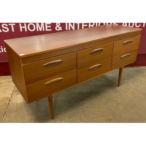 67 - A teak six drawer sideboard/chest