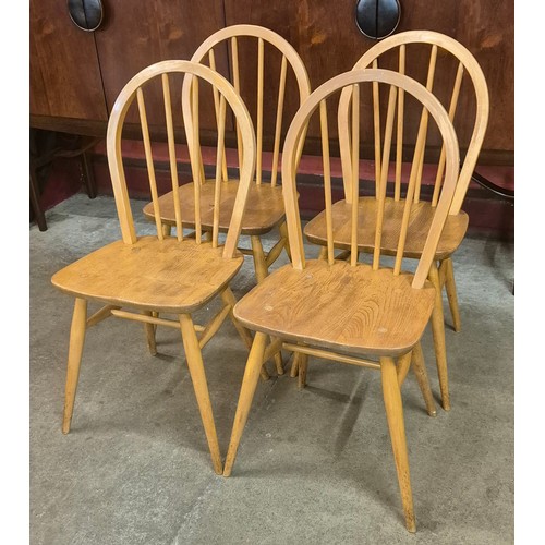 81 - A set of four Ercol Blonde elm and beech Windsor chairs