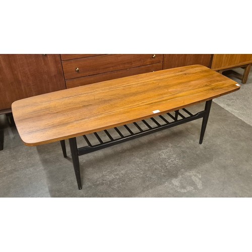 102 - A teak and black rectangular coffee table