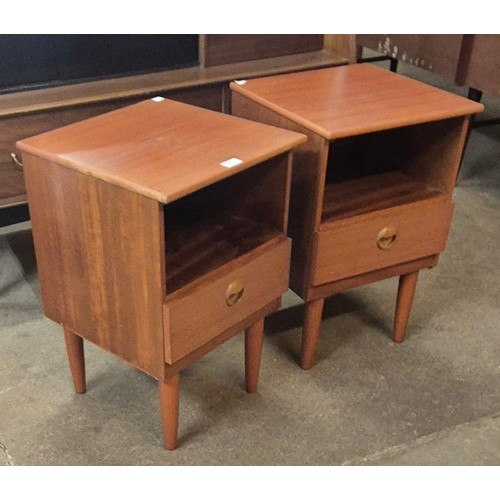 112 - A pair of teak bedside cabinets