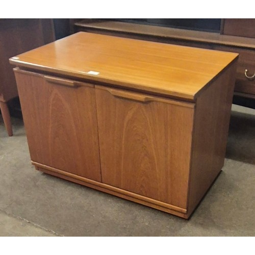 113 - A small teak two door cabinet