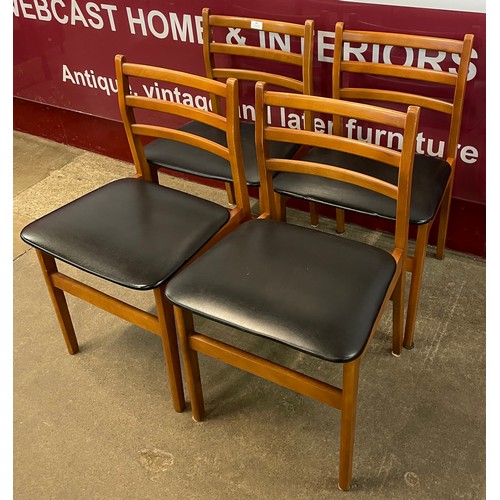 63 - A set of four teak dining chairs