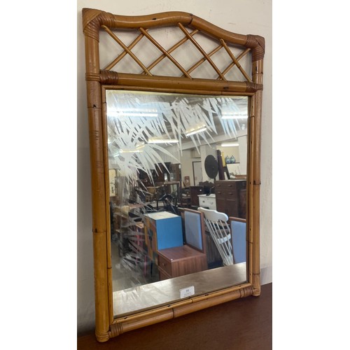 77 - An etched glass bamboo framed mirror