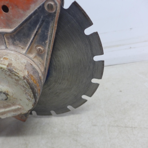 5001 - A Stihl TS350 petrol stone cutting saw with a quantity of various saw blades