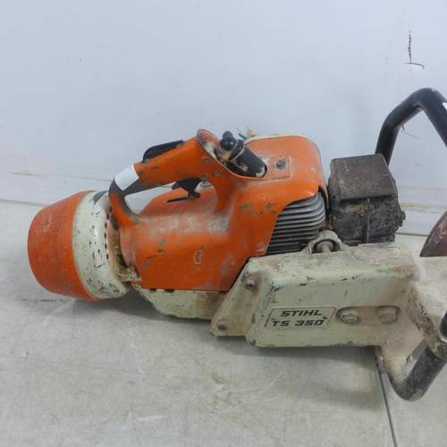 5001 - A Stihl TS350 petrol stone cutting saw with a quantity of  various saw blades