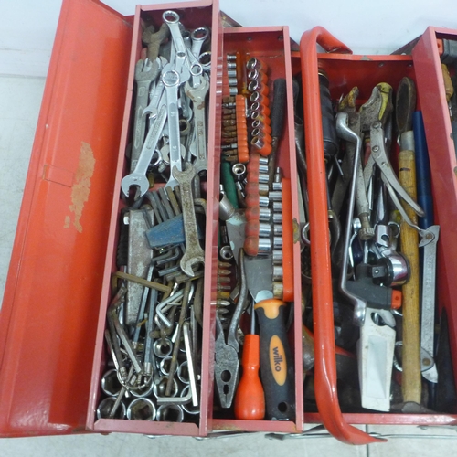 5012 - A red metal cantilever toolbox of assorted hand tools including spanners, screwdrivers, allen keys, ... 