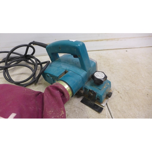 5031 - Four 110v power tools including Makita 9401 belt sander, a Makita electric planer, a Makita BO6030 o... 