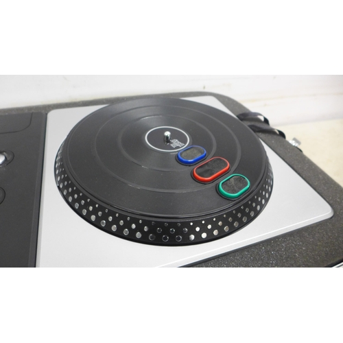 5042 - A PlayStation DJ Hero wireless turntable controller, cased, no game