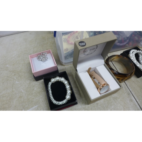 5055 - A box of assorted costume jewellery and wristwatches