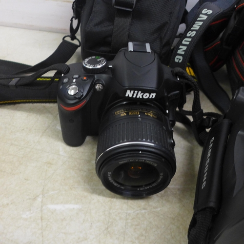 5066 - A Nikon D3200 camera, a Practika camera, Tamron lens, camera accessories and a Samsung video camera