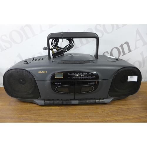 5095 - A Bush SRC280CD portable CD player with a Trust PC speaker system