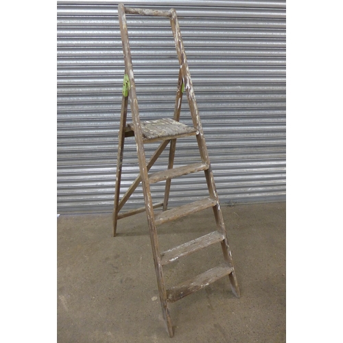 5120 - Two wooden stepladders and one metal step ladder