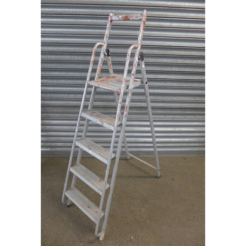 5130 - A triple 4 rung loft ladder with hand rail, with a set of Abru 5 rung aluminum A frame step ladders