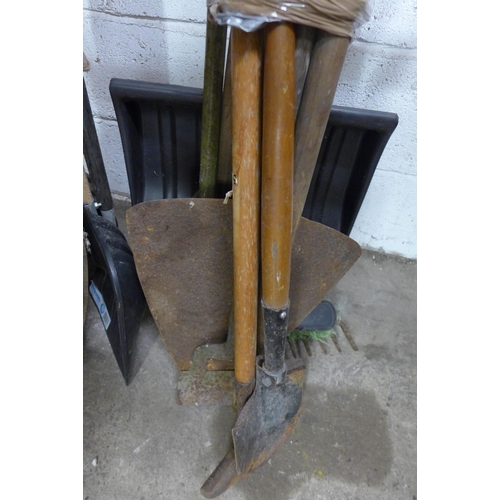 5151 - Two bundles of garden tools including rakes, hoes, shovels, spades, brushes, forks etc.