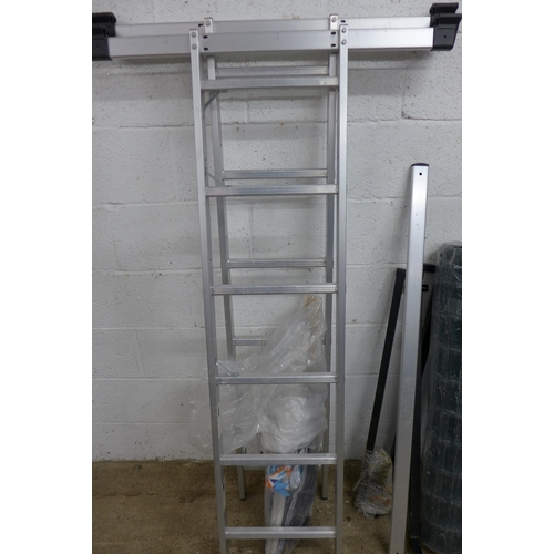 5160 - A roll of Simpa 10m PVC coated mesh fencing and a platform ladder