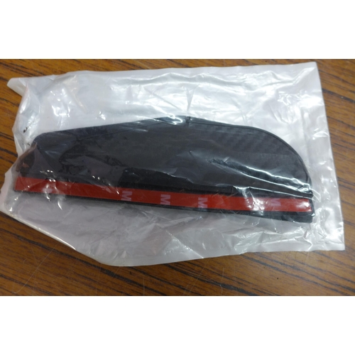 5194 - A bag of various car parts and accessories including mud flaps, oil pressure meter etc.