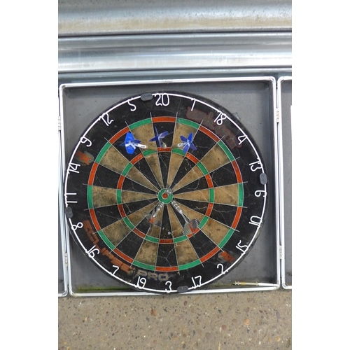 5234 - A dartboard with darts and a collection of various snooker cues including Rileys Eclipse in hard cas... 